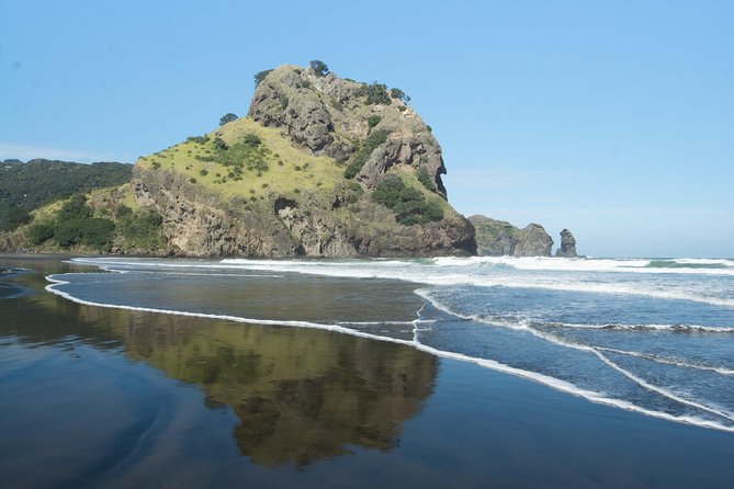 Afternoon Piha Beach and Rainforest Tour from Auckland - Piha Beach: black sand, rough water, and photo chances