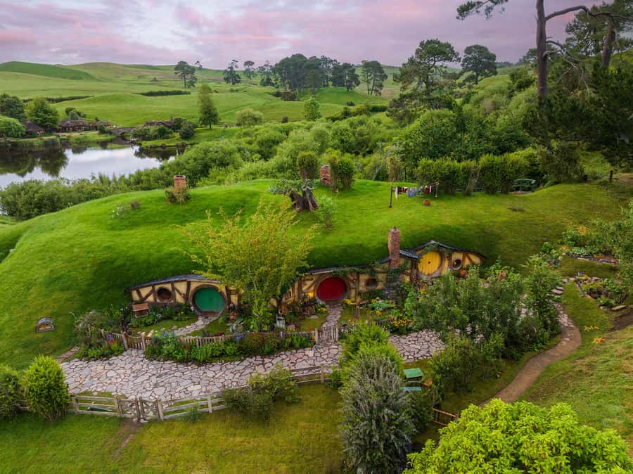 From Auckland: Hobbiton Movie Set Day Tour with Picnic Lunch - Entering Hobbiton: 12 acres, 44 hobbit holes, and the details that matter