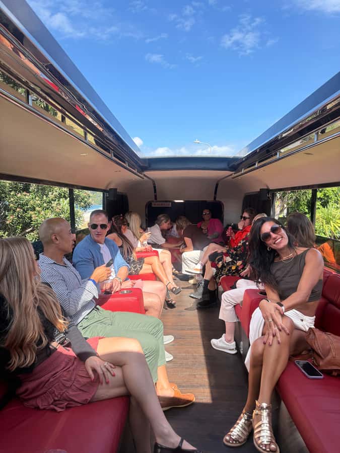 Waiheke Island: Scenic Wine Tour on Double Decker Bus - Onetangi Beach walk and Oneroa village time: balance between wine and fresh air